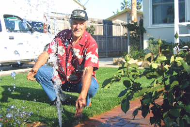 Berkeley sprinkler repair man checks on a broken sprinkler head